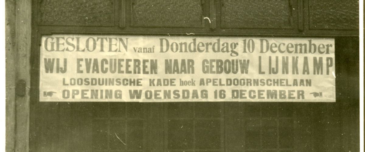 Sign on a shop in Valeriusstraat: 'We evacuate to...'.